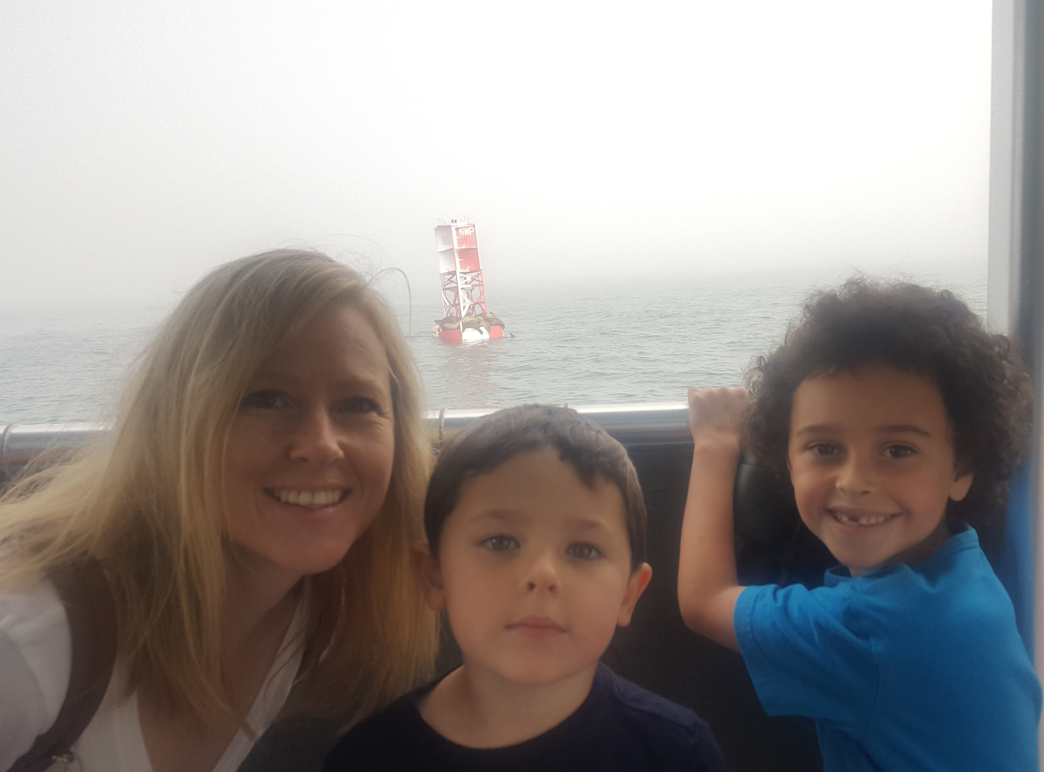 Shari and her two boys sharing a moment on the boat