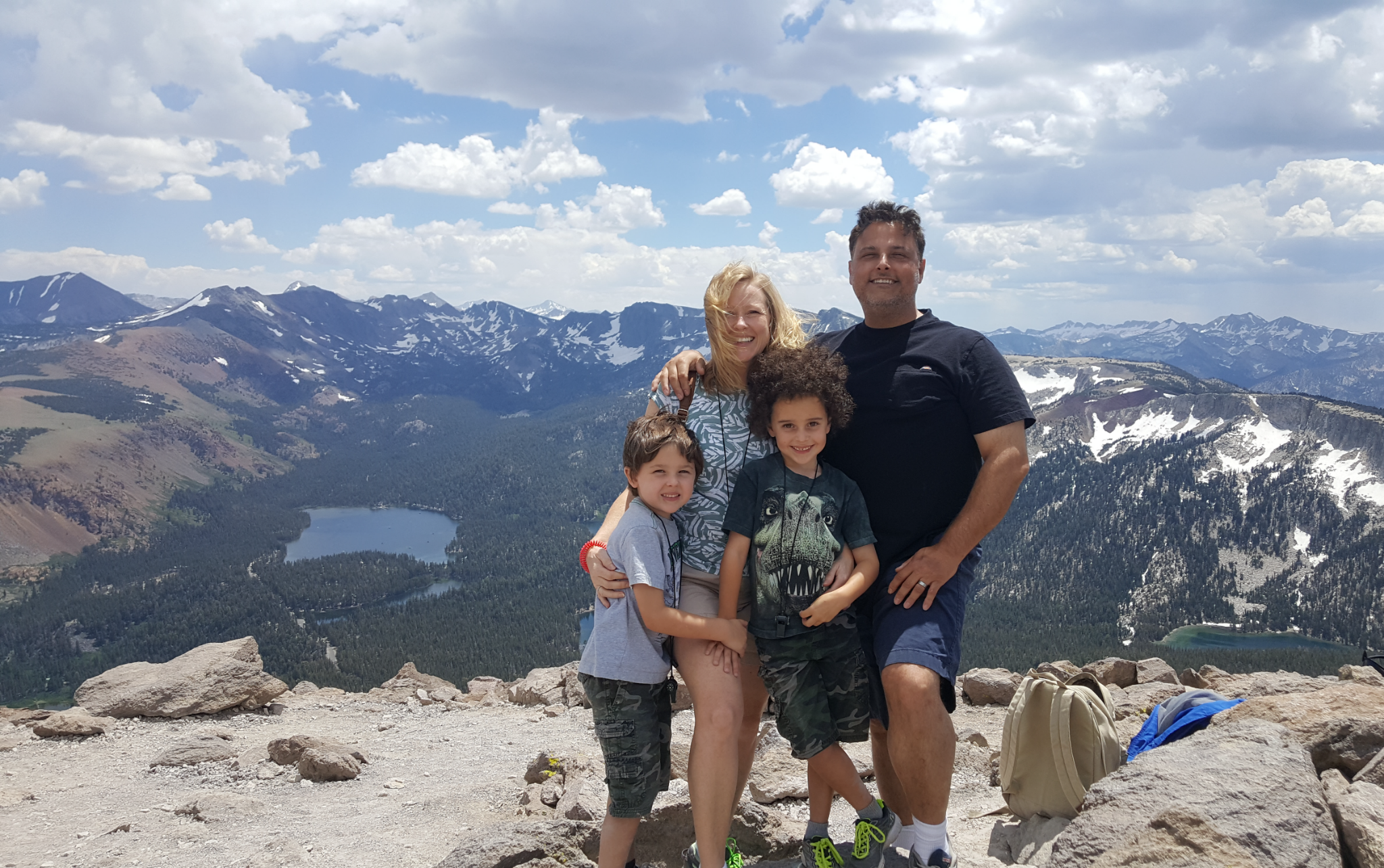 Shari and her family together in the mountains